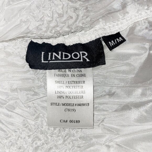 M | Lindor | Textured Sleeveless Ruffle-Hem Blouse - Picture 4 of 4